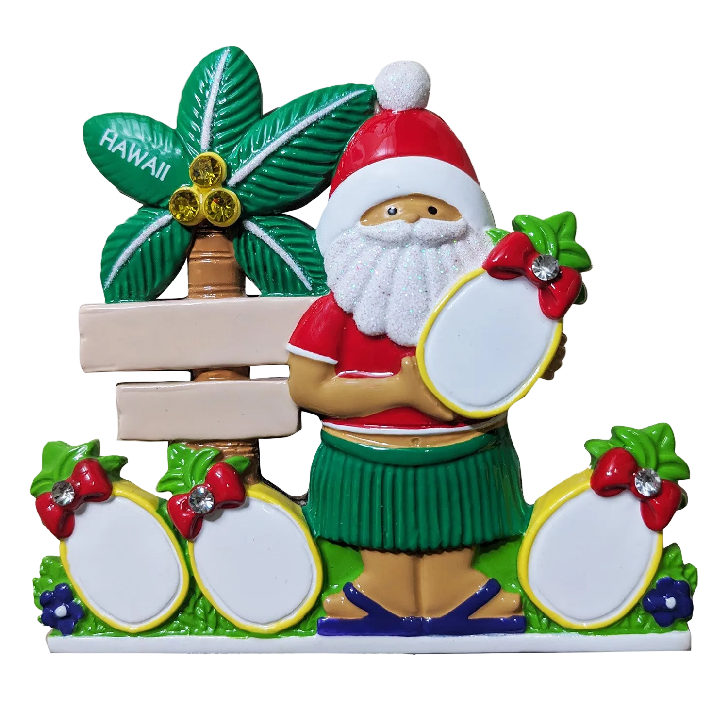 A colorful Santa Claus-themed Hawaiian souvenir ornament or decorative figurine. The figure wears a red Santa hat and a green hula skirt, holding a blank pineapple for personalizing.
