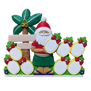 A colorful Santa Claus-themed decorative plaque or table topper with a green Hawaiian hula skirt, red hat, white beard, a palm tree labeled Hawaii, and multiple pineapple slots for personalizing in yellow with red bow details.