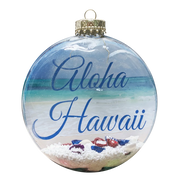 Decorative Hawaiian Christmas ornament with 'Aloha Hawaii' text and beach scene.